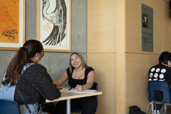 Richelle studying on campus with a fellow student