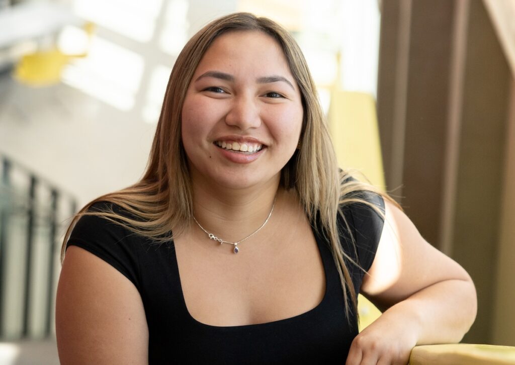 Richelle smiling on the stairs at UBC Okangan