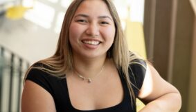 Richelle smiling on the stairs at UBC Okangan