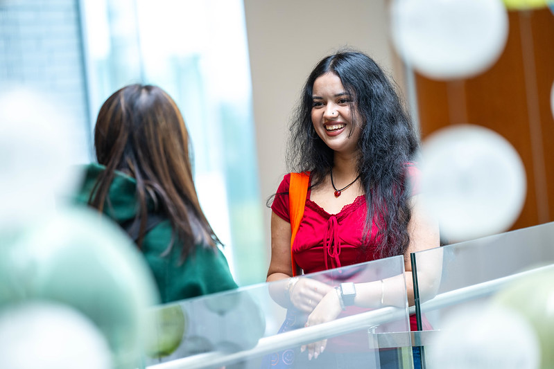 Two students standing in Allard Hall